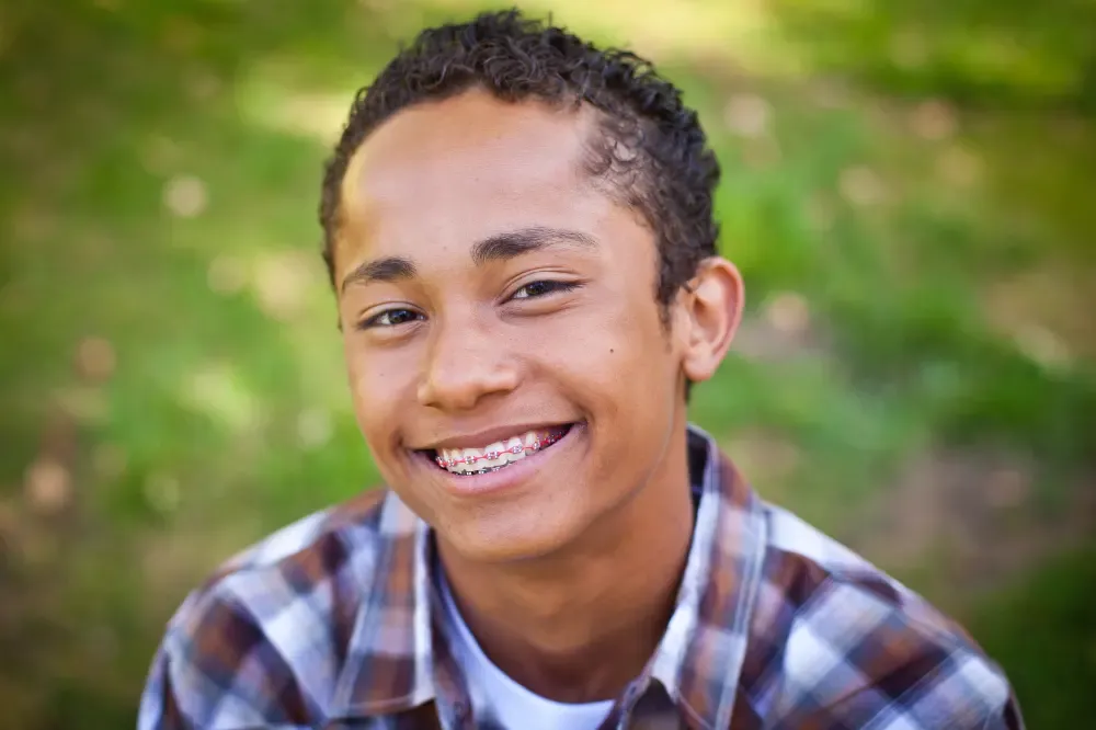 Smiling teen boy with braces