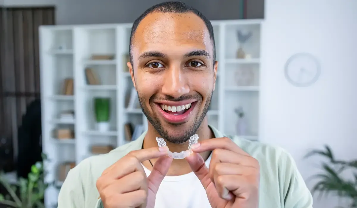 Man putting on aligner